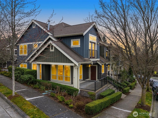 view of front of home featuring a porch, board and batten siding, and roof with shingles