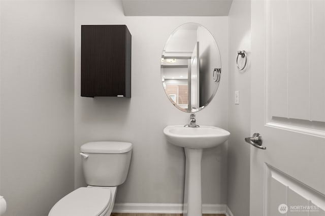 bathroom with sink and toilet