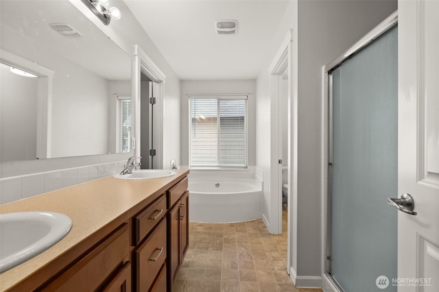 full bathroom featuring toilet, vanity, and plus walk in shower