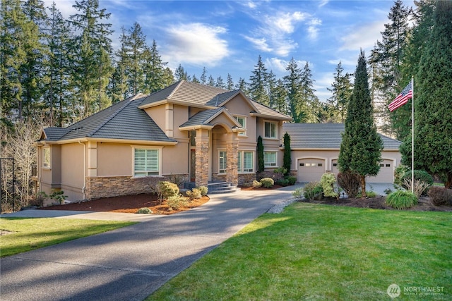 view of front facade featuring a garage and a front yard