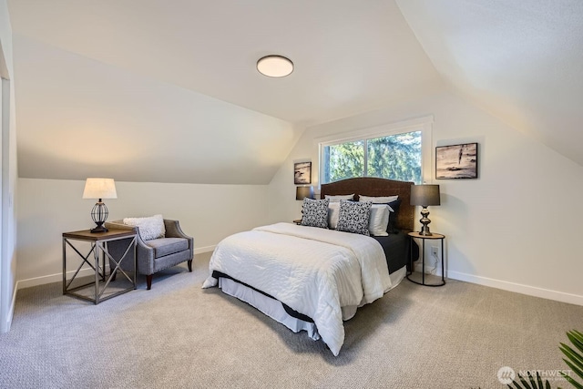 carpeted bedroom featuring vaulted ceiling