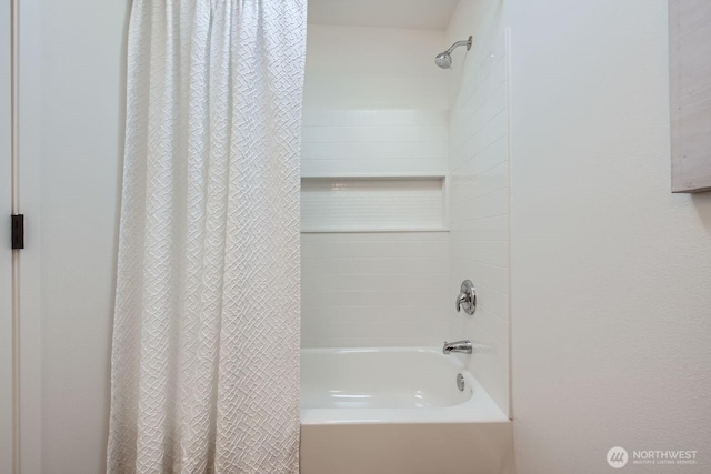 bathroom featuring shower / tub combo with curtain