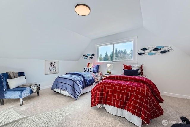 bedroom featuring lofted ceiling and carpet flooring