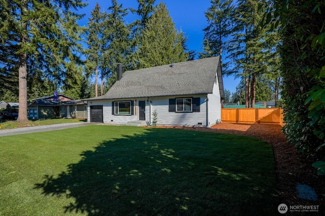 view of front of house featuring an attached garage, fence, driveway, crawl space, and a front yard