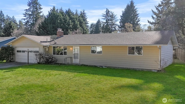 ranch-style home with a garage and a front yard