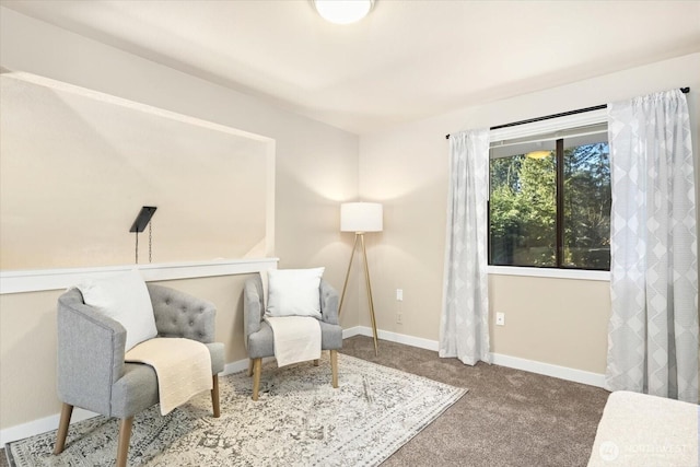 living area featuring carpet floors and baseboards