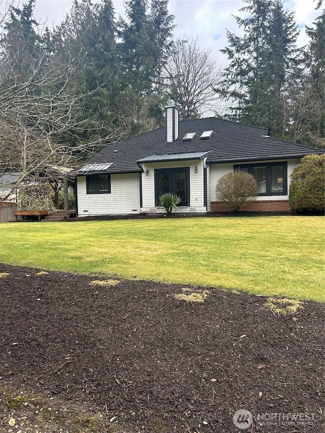 ranch-style house with a front lawn and a chimney