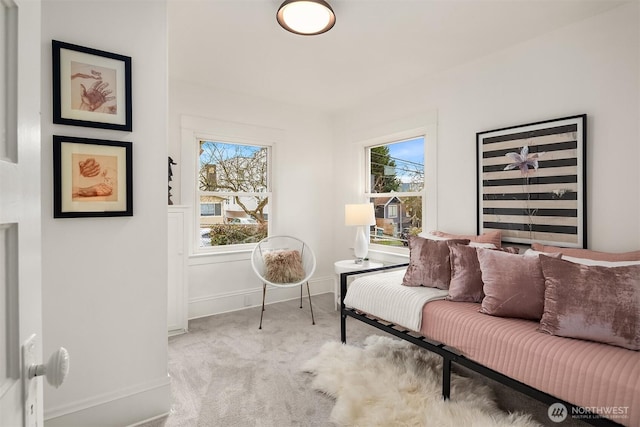 sitting room with light colored carpet