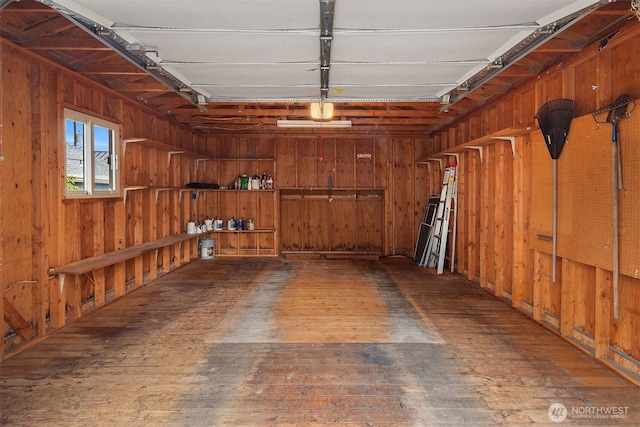 garage with wood walls