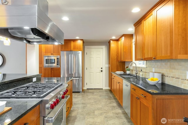 kitchen featuring stainless steel appliances, extractor fan, a sink, and brown cabinetry