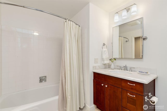 bathroom featuring shower / tub combo with curtain and vanity