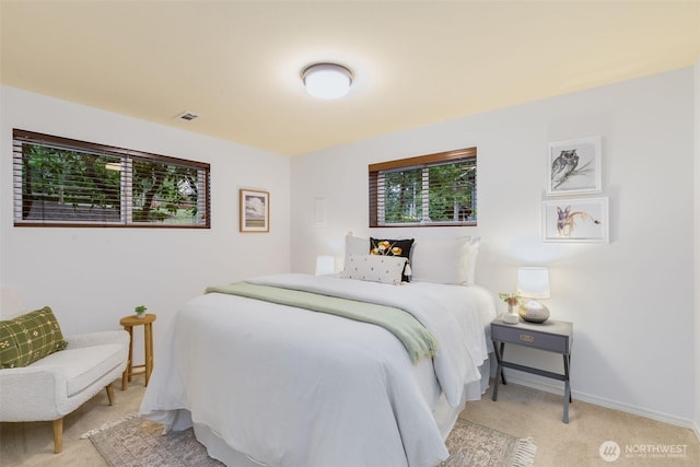 bedroom featuring carpet floors, baseboards, and visible vents