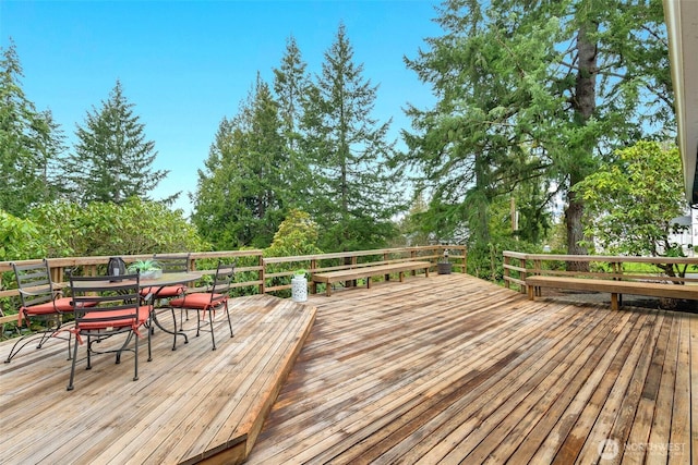 deck with outdoor dining space