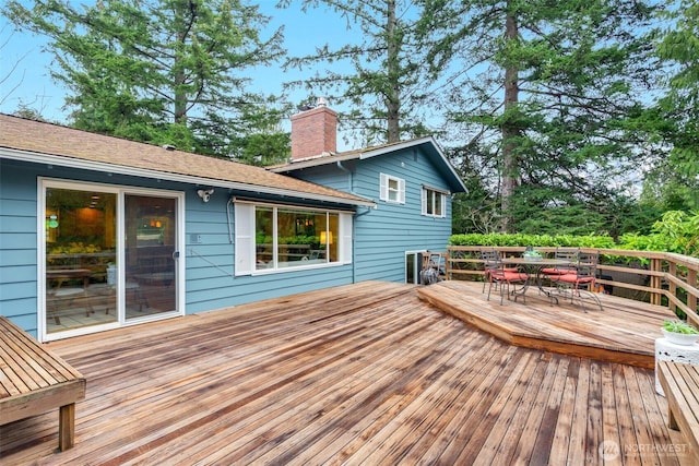 wooden deck featuring outdoor dining space