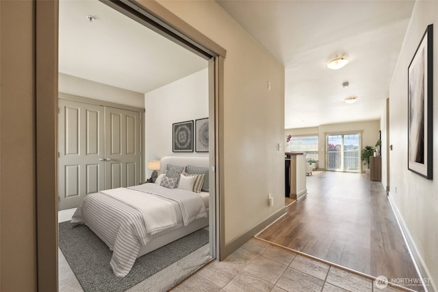 bedroom featuring light tile patterned flooring