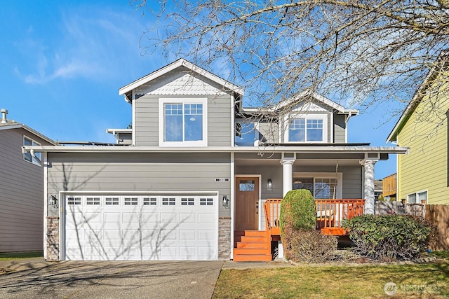 craftsman-style house with a garage and covered porch