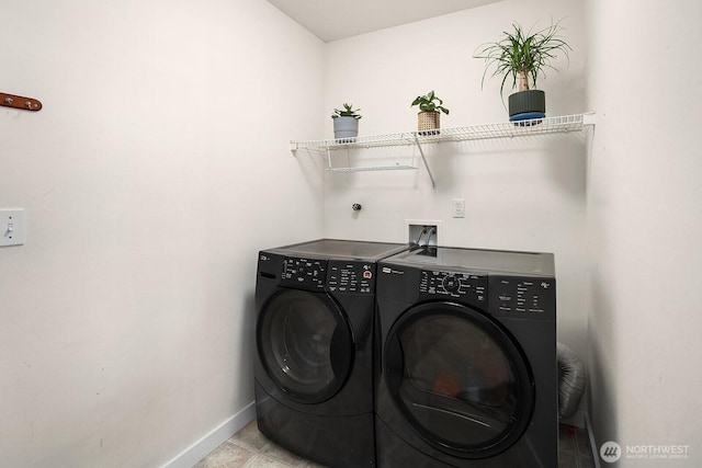 washroom featuring light tile patterned flooring and separate washer and dryer