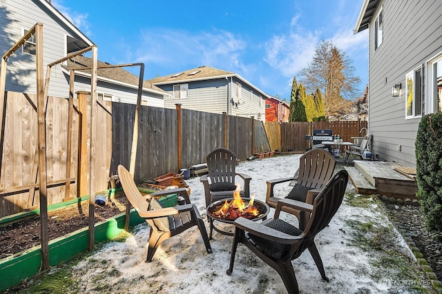 view of patio featuring grilling area and an outdoor fire pit