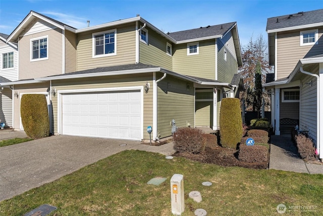 view of front of home with a garage and a front yard