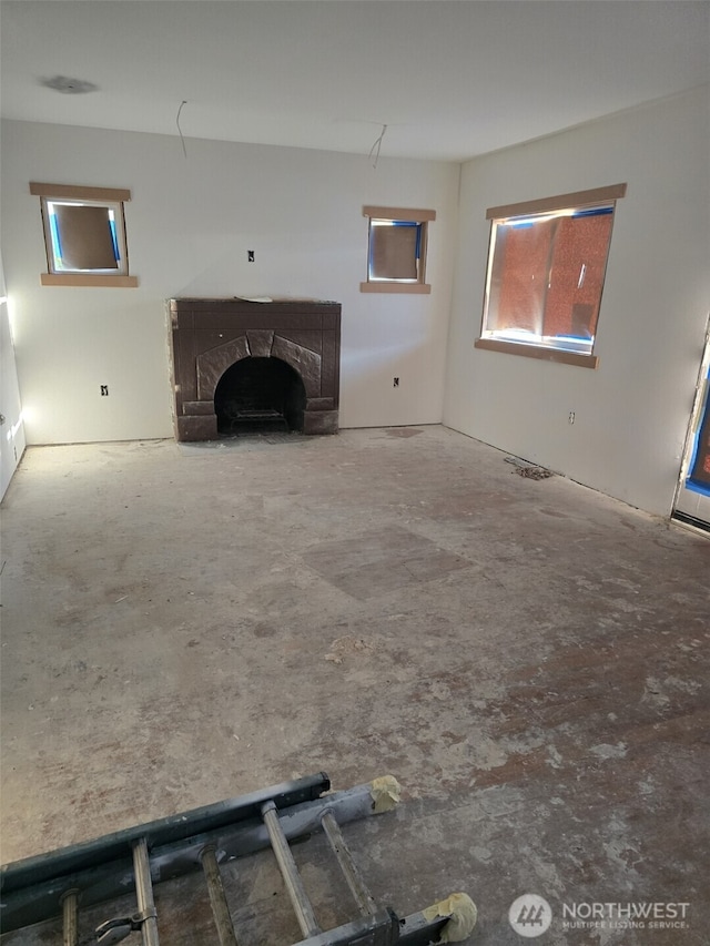 unfurnished living room featuring a fireplace