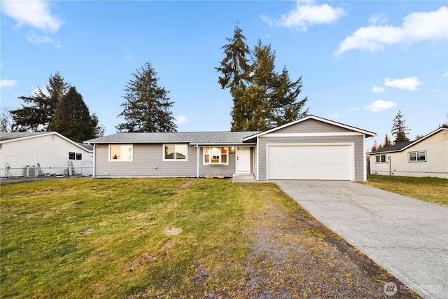 ranch-style house featuring a garage, central AC unit, and a front lawn