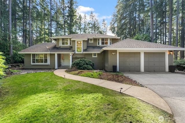 view of front of house featuring a garage and a front lawn