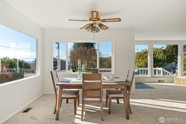 sunroom / solarium featuring ceiling fan