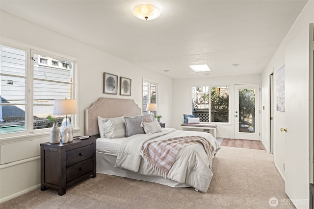 bedroom with light colored carpet