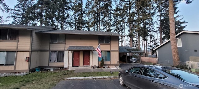 view of front of home featuring fence