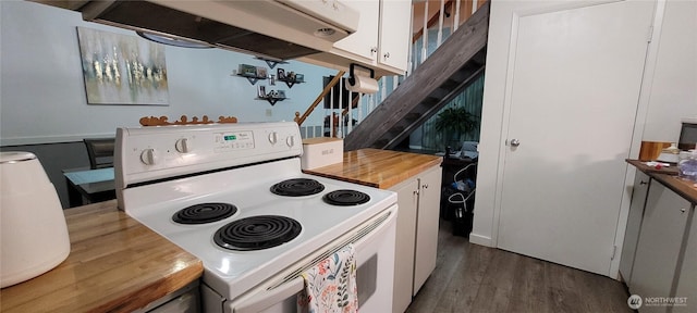 kitchen featuring white range with electric stovetop, white cabinetry, wood finished floors, butcher block countertops, and extractor fan