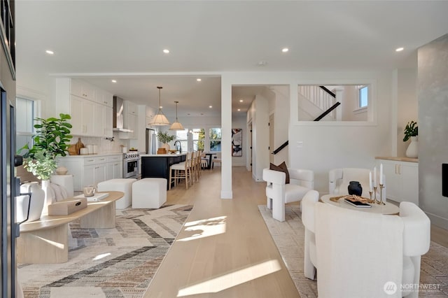 living room with light hardwood / wood-style flooring