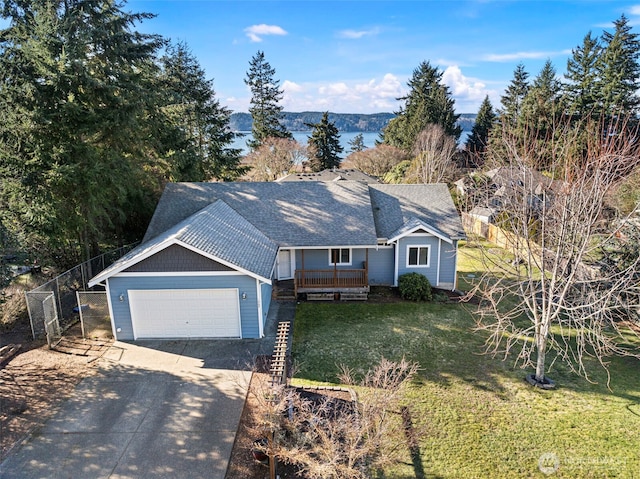 view of front of home with a garage and a front lawn