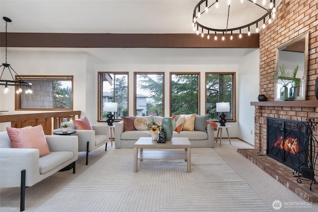 living room with a notable chandelier, carpet, a brick fireplace, and a wealth of natural light