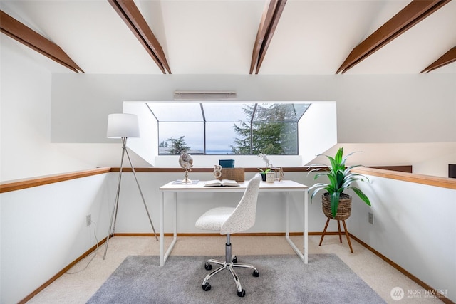 office with vaulted ceiling with beams and light colored carpet