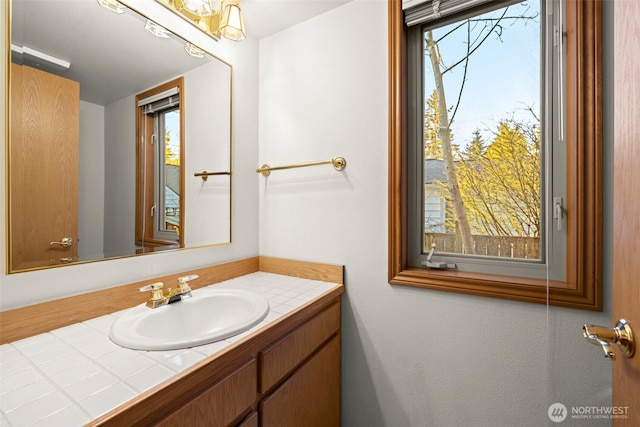 bathroom featuring vanity and plenty of natural light