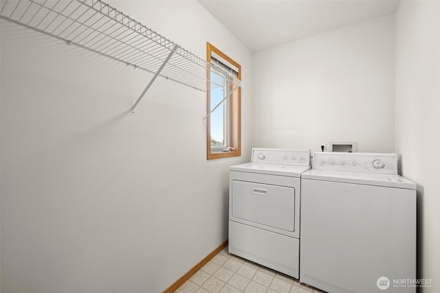 washroom with washing machine and clothes dryer