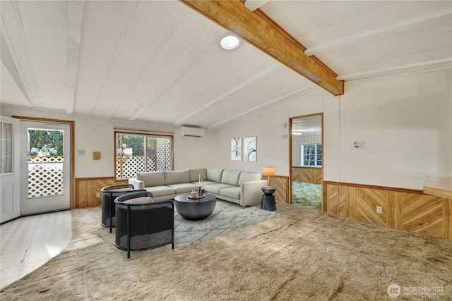 carpeted living room featuring vaulted ceiling with beams, a wall unit AC, and wood walls