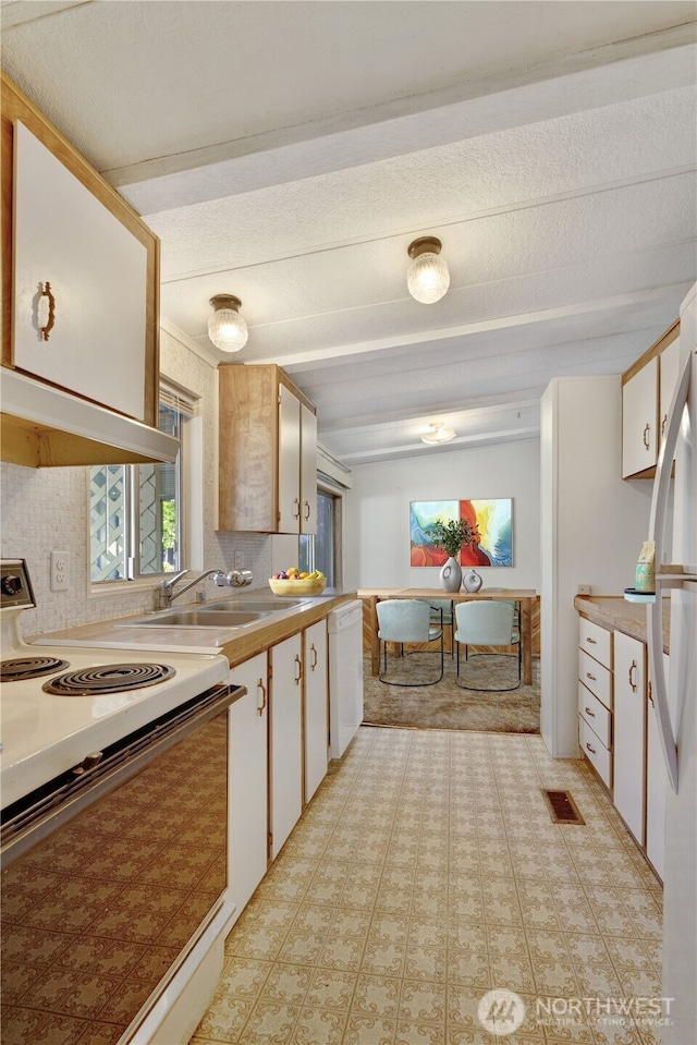 kitchen with white cabinetry, white appliances, tasteful backsplash, and exhaust hood