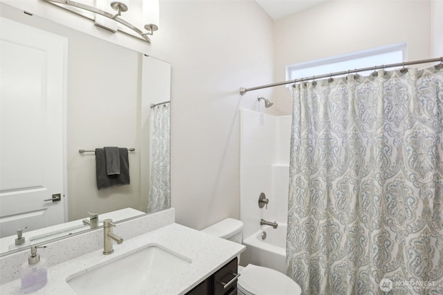 full bathroom with vanity, shower / bath combination with curtain, and toilet