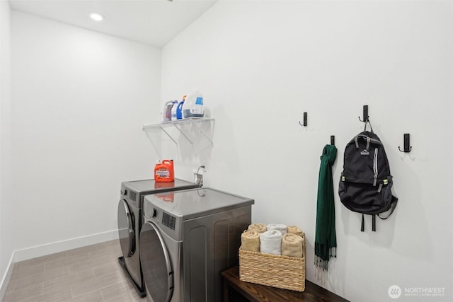 clothes washing area featuring washing machine and dryer