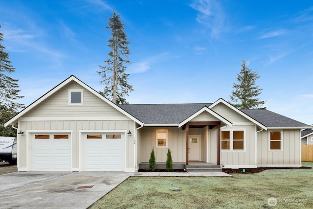 view of front of property with a garage and a front lawn