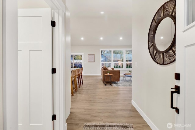 hall with light wood-type flooring