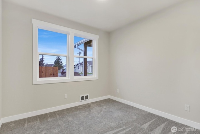 empty room with carpet flooring