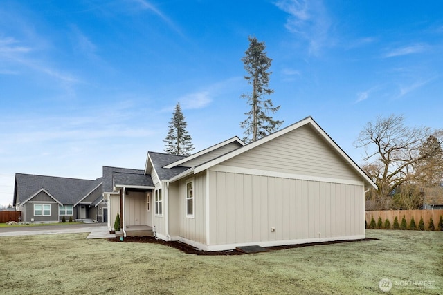 view of property exterior featuring a lawn