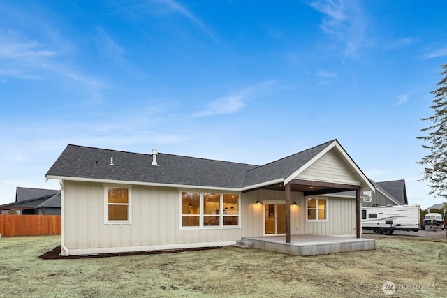 back of house featuring a yard