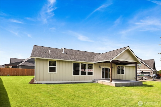 104 Sable Dr, Everson, WA 98247 - rear view of property featuring a shingled roof, a patio area, and board and batten siding