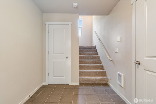 staircase with tile patterned floors