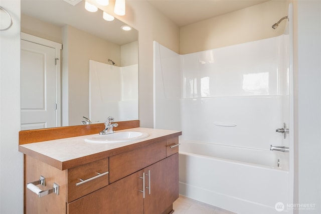 bathroom with shower / bath combination, vanity, and tile patterned flooring