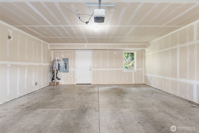 garage featuring a garage door opener and electric panel