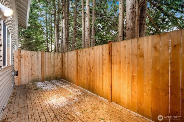 wooden terrace with a patio